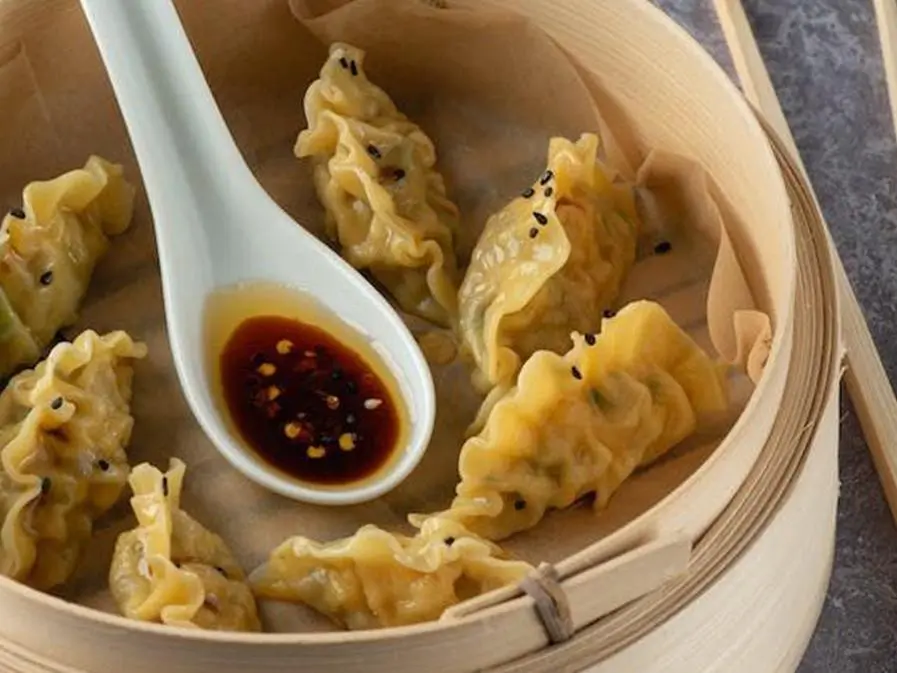 Go-Believe-Bakery-Shop-Sesame-Steamed-Dumplings-New-York Sesame Steamed Dumplings - Steamed dumplings topped with sesame, filled with savory filling at Go Believe, a Bakery Shop in New York